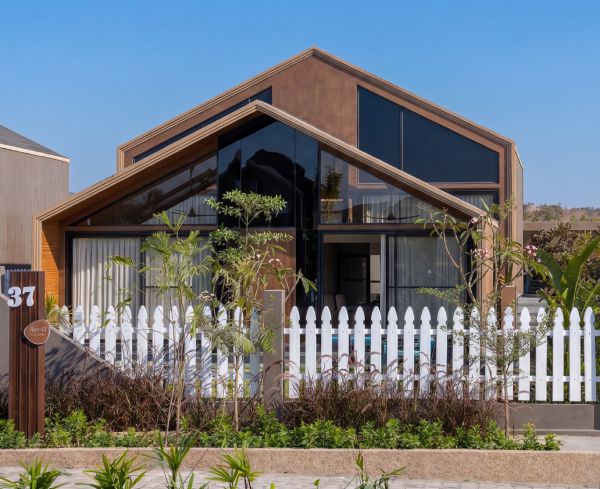 2 BHK villa — modern façade with landscaped front at Beverly Hills