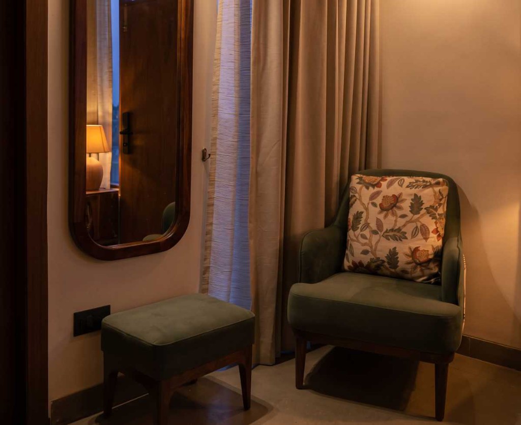 2 BHK villa reading nook with velvet armchair