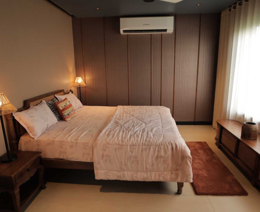 3 BHK villa bedroom with floral linens