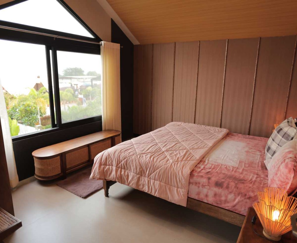 3 BHK villa bedroom with vaulted wood ceiling