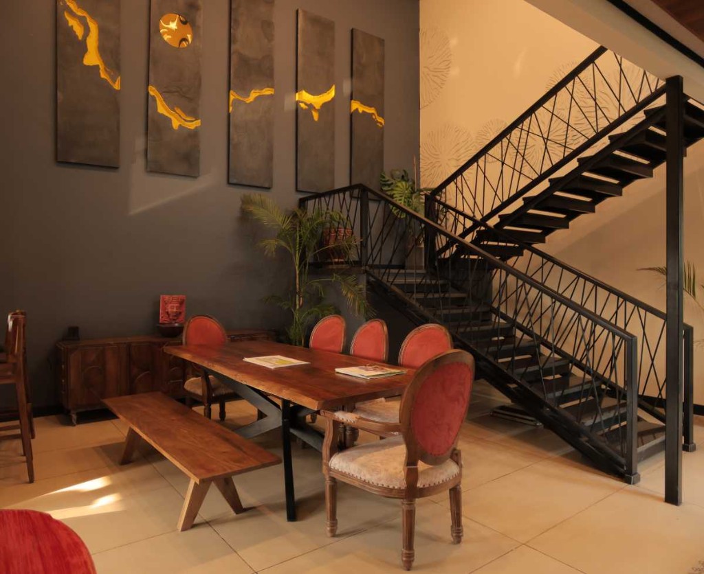 3 BHK villa dining area with live-edge table